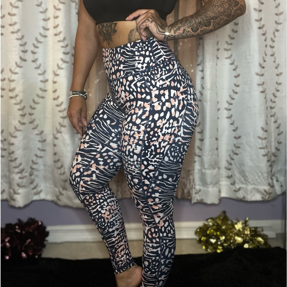 Curves N Combatboots navy, pink, and white animal print leggings with pockets